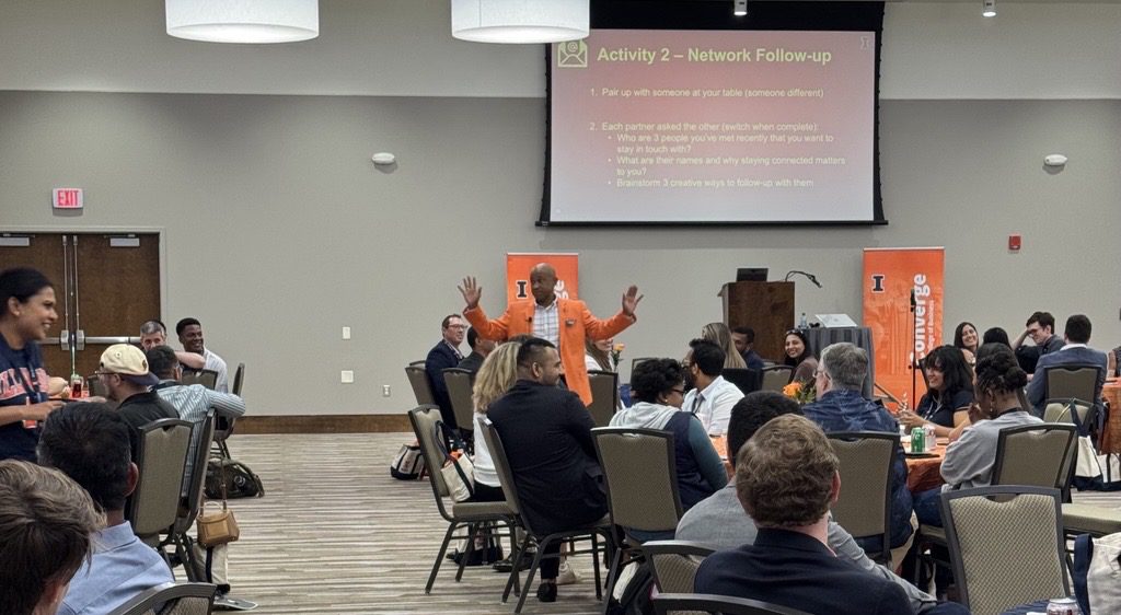 Presenter speaking to attendees in conference room